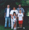 Posted by Sherri-in-OH on 5/3/2001, 13KB
Well, here it is. Our family picture. This is from last summer.  Back row: Oldest son, Jeremy, me, husband Sonny. Front r