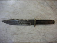A knife with sawteeth machined into the back side of the blade.