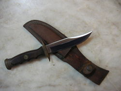 miniaturized bowie knife (hunting knife).