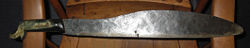 Mexican Machete, from Acapulco, 1970.  Horn handle, hand forged blade taper (hammer marks visible.).  (Has been sharpened by owner. Rust marks visible.)