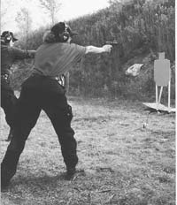 Nancy Crenshaw uses strong stance and technique to make up for lack of size as she turns in an excellent one-handed high speed performance with SIG 9mm.