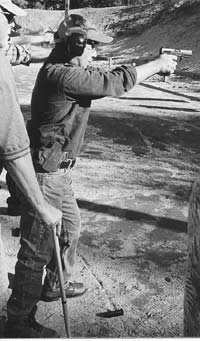 This student demonstrates a strong Weaver stance at an LFI class. Feet are in proper pyramidal base, upper body is forward, and he is firmly grasping his .40 caliber Walther P99.