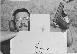 Accuracy tends to degrade with speed. Author fired the chest shots in hyperspeed mode, the eight shots in one hole in the neck at a more deliberate pace. Pistol is SIG P220 .45.